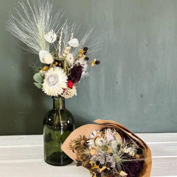 winter dried flower posy in glass vase