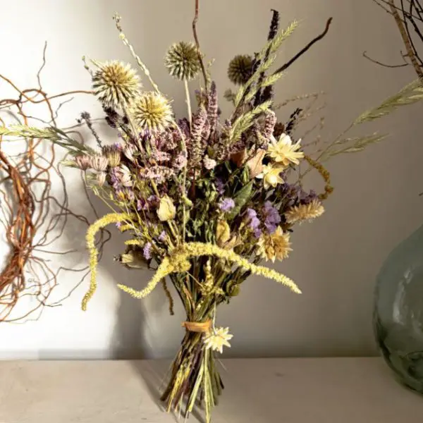 purple dried flower bouquet in rich purples and soft winter whites, featuring British-grown dahlias, eryngium, and my signature curly willow